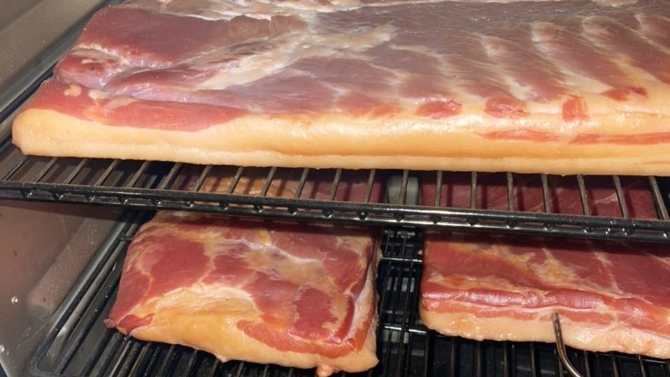 Artisanal Applewood Smoked Bacon Bacon on the vertical pellet smoker